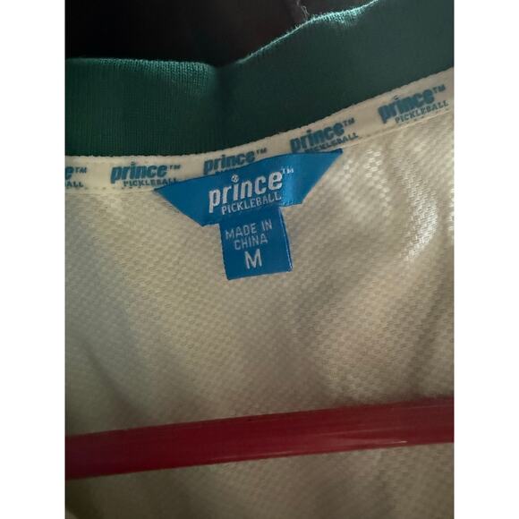 The product shown is the Prince Pickleball Women's Collared Pleated Dress - Picture 3 of 3